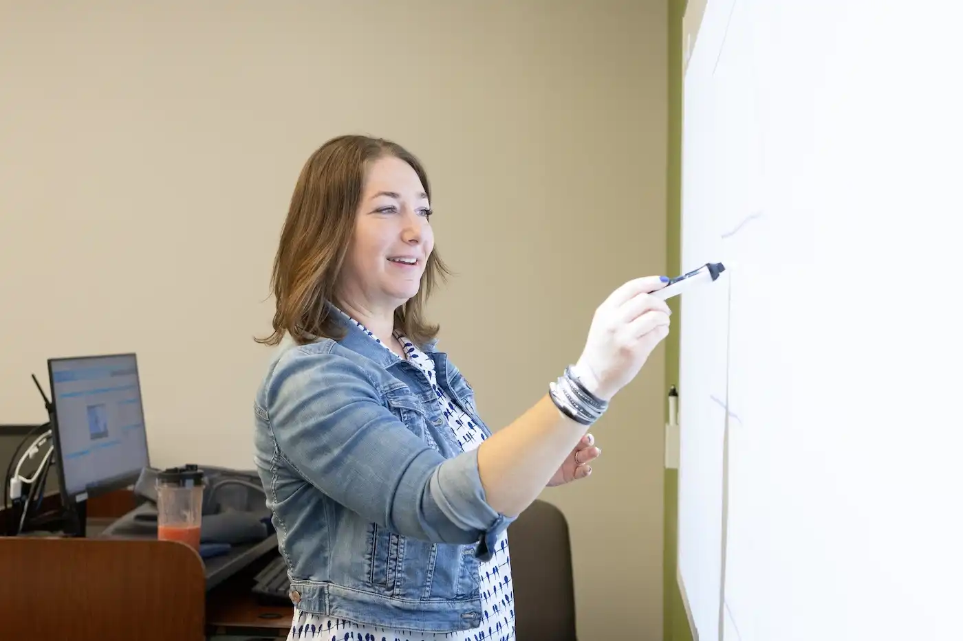 teacher drawing on whiteboard