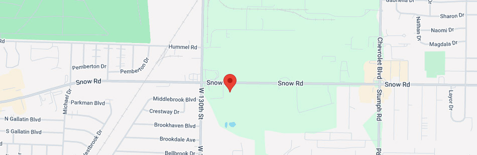 Map view showing a pin on Snow Rd, intersecting with W 130th St, Chevrolet Blvd, and Stumph Rd, with nearby streets and green park area visible.