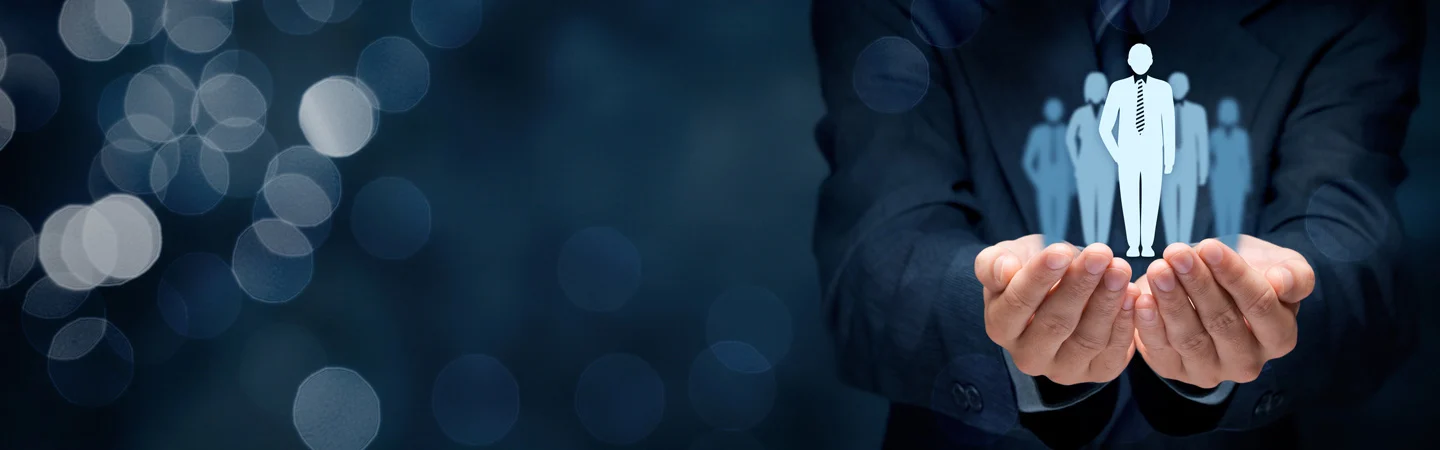 Close-up of hands holding a holographic group of people, with one figure standing in front, symbolizing leadership.