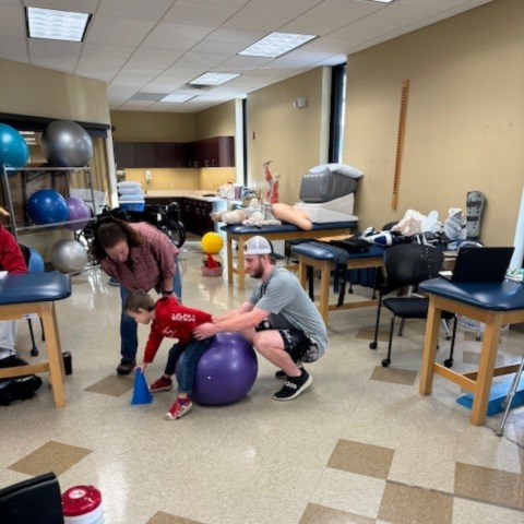 PTA Student Practicing with Patient in Solon, OH Lab - Bryant & Stratton College