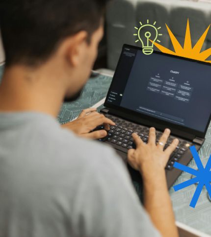 A person types on a laptop with a dark screen, featuring a menu. Illustrated icons—a light bulb, orange burst, and blue starburst—suggest creativity and ideas inspired by AI job search tools for professional development.
